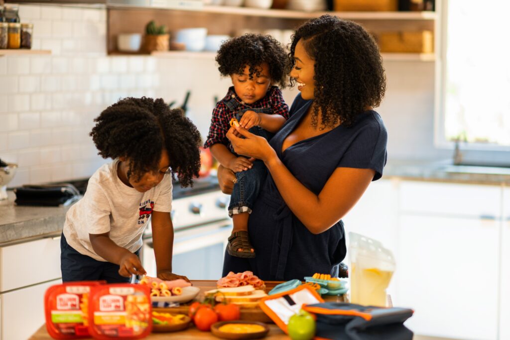 a mother and children trying healthy snacks for kids with diabetes