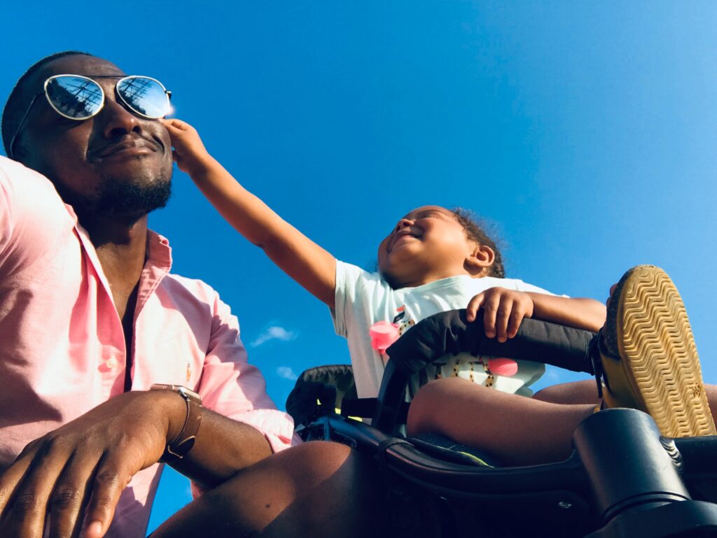 A positive father laughing with his daughter, which is crucial if you want to talk to your child about diabetes