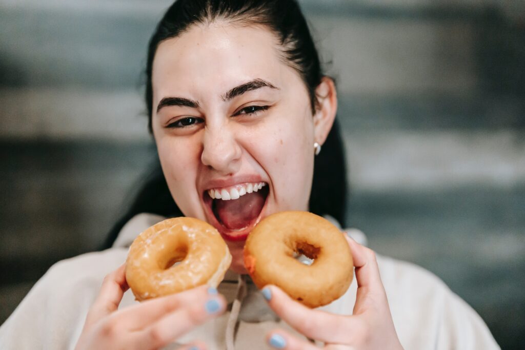 A woman eating donuts