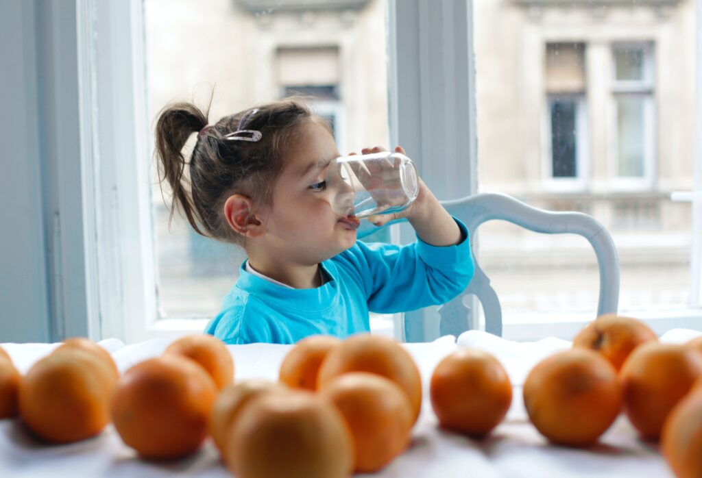 Little girl drinking water