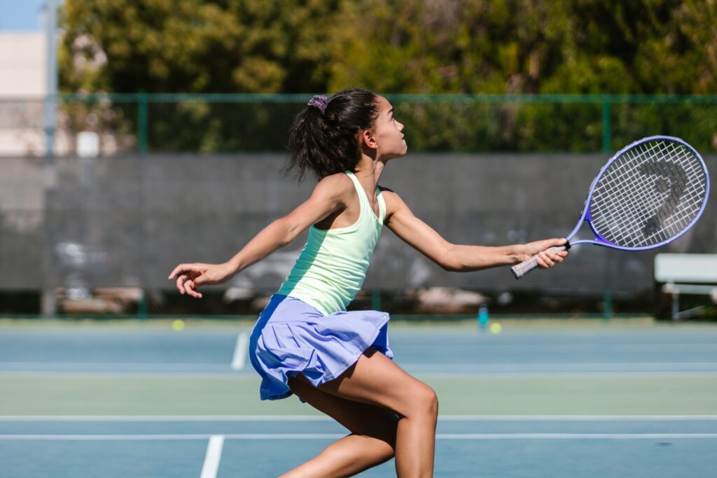 A girl playing tennis