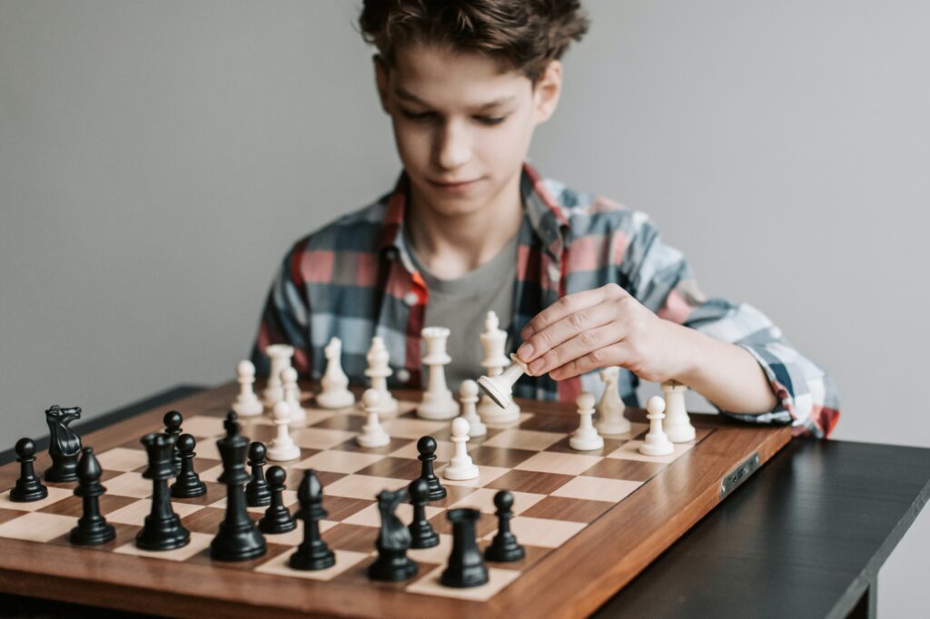 A boy playing chess.