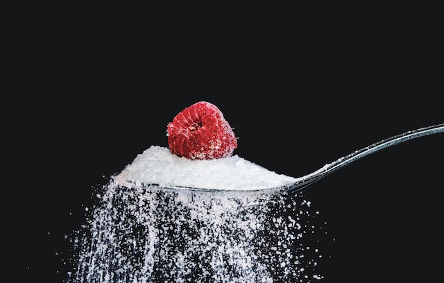 Raspberry on white sugar