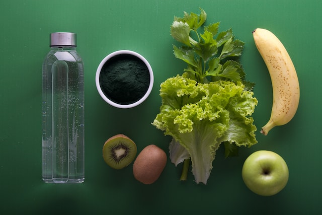 Water bottle and green food