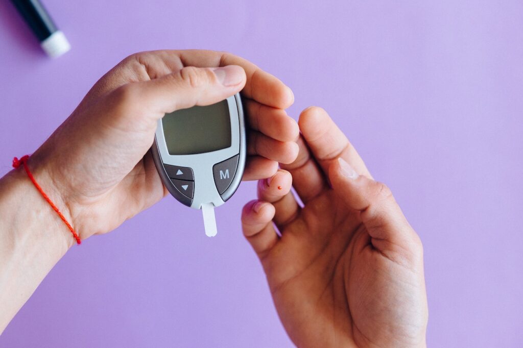 Person measuring blood sugar