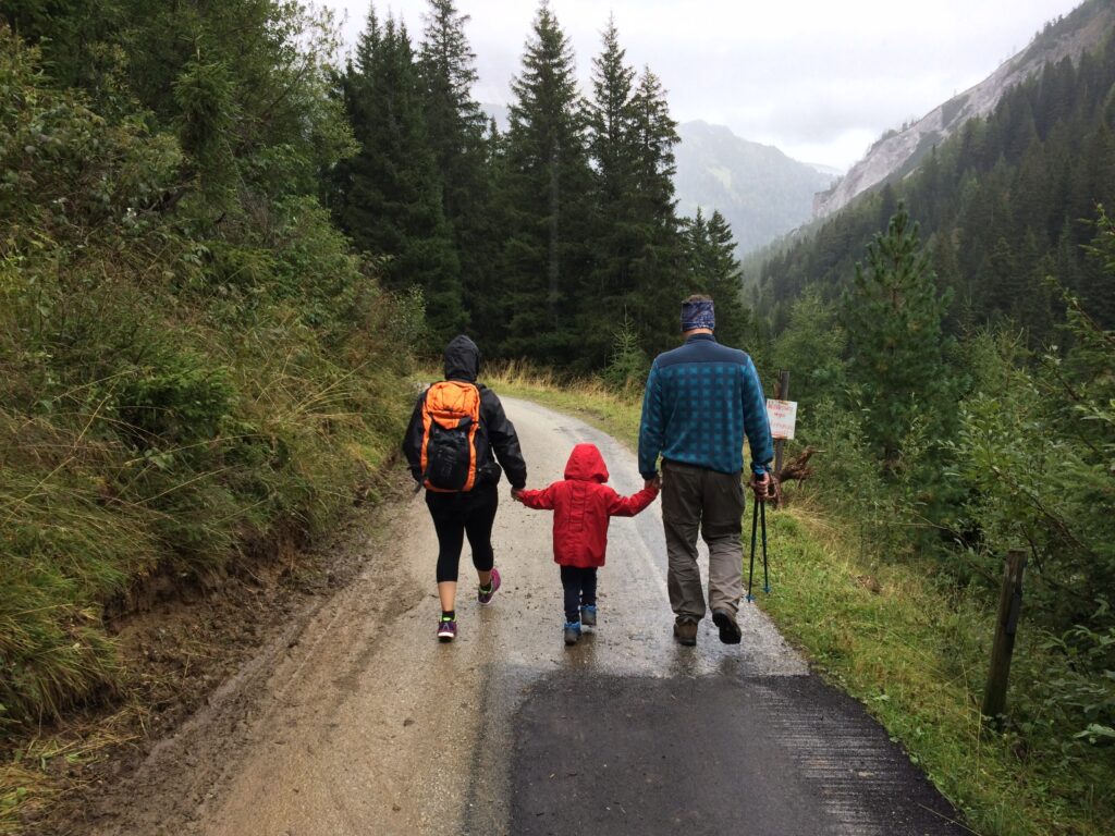 Family of three hiking in the woods