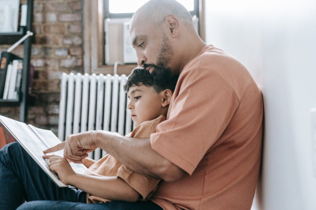 A father reading a book with his child