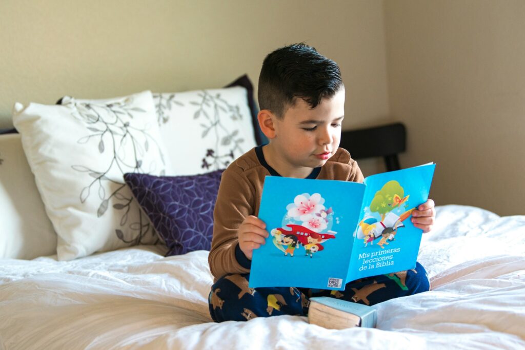 A young child reading a picture book, enhancing visual learning