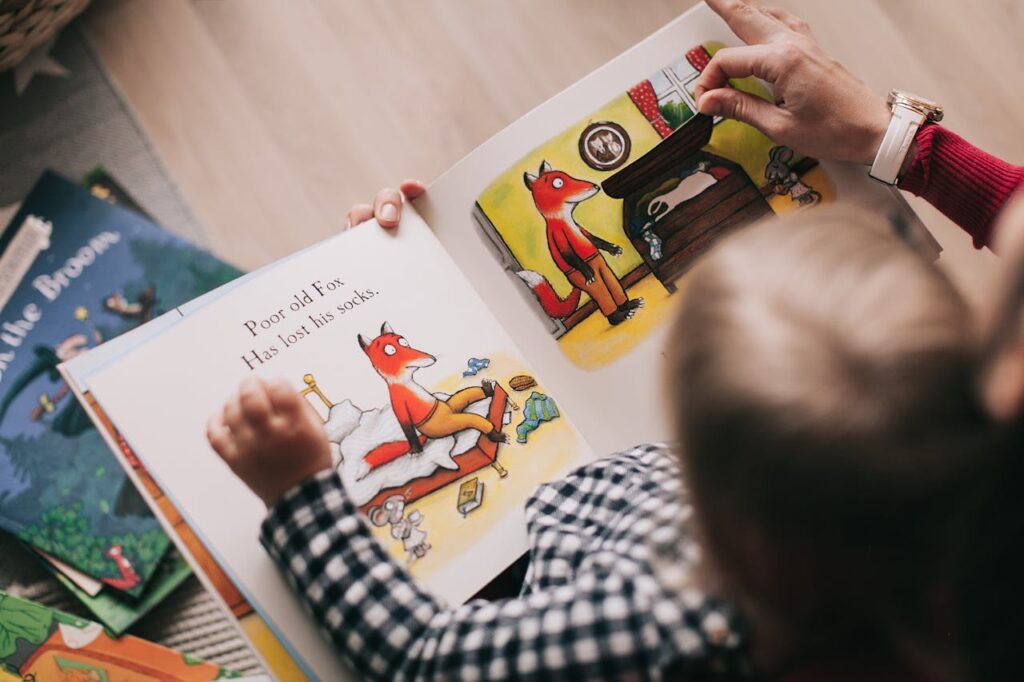 Little kid looking at a kids’ book